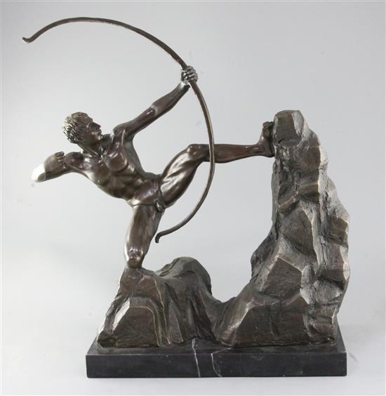 A bronze figure of a nude archer standing upon a rocky outcrop, 22in.